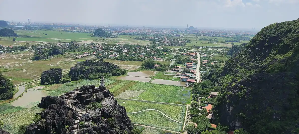 Rice fields and karst hills seen from a rocky viewpoint